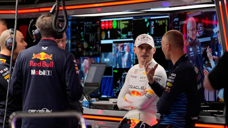 Red Bull driver Max Verstappen of the Netherlands chats with...