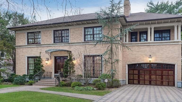 This Garden City Colonial-style manse includes an indoor swimming pool...