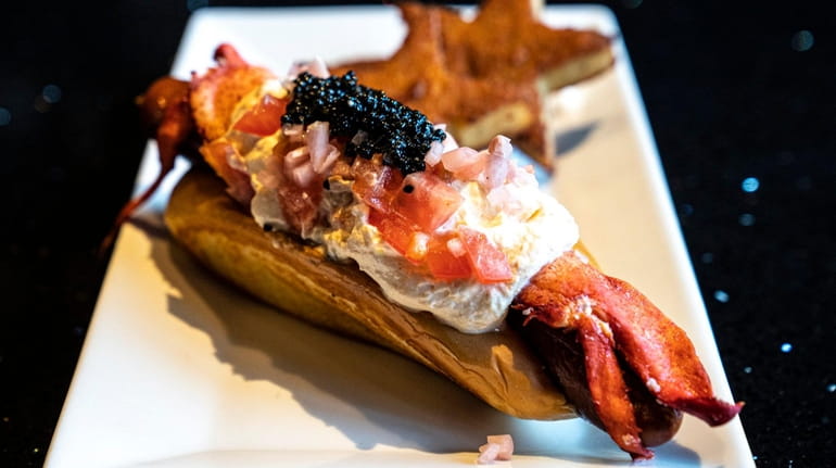 The Rock City Dog, topped with lobster, whipped horseradish, tomato, champagne...