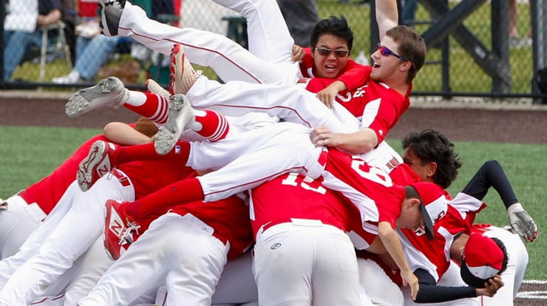 Center Moriches' baseball team celebrates its second straight state title...