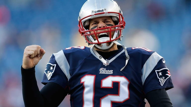 New England Tom Brady reacts to the cheers of fans...