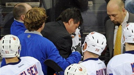 Jack Capuano leaves the bench after getting hit with a...