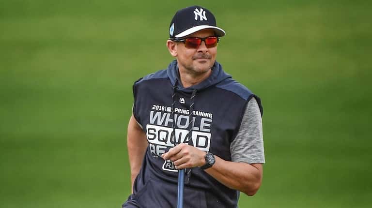 Yankees manager Aaron Boone on the field during spring training...