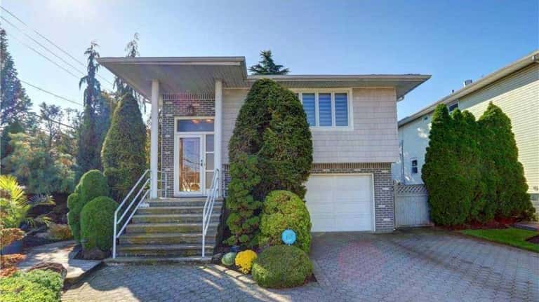 Listed for $739,000 in Lynbrook, this four-bedroom, two-bathroom house has...