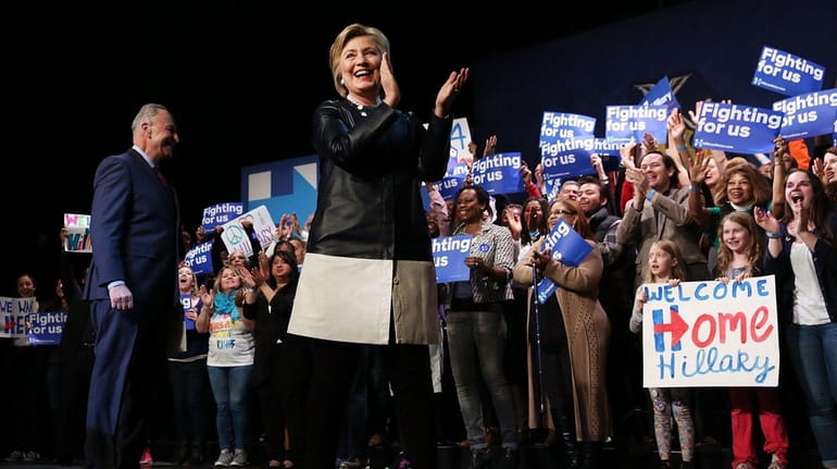 Democratic presidential candidate Hillary Clinton walks onto stage in Harlem...