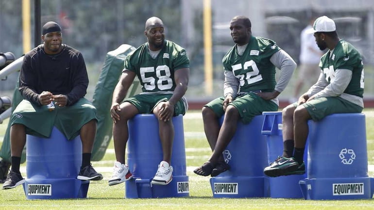 New York Jets players, from left, Calvin Pace, Bryan Thomas,...