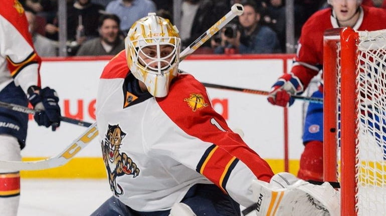 Florida Panthers goaltender Roberto Luongo stretches out the glove during...