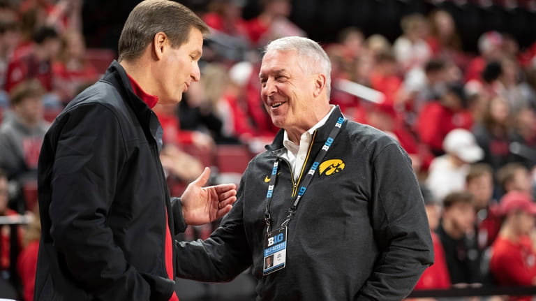 Nebraska athletic director Trev Alberts, left, chats with Iowa athletic...