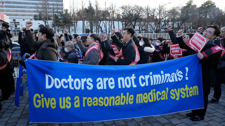Doctors stage a rally against the government's medical policy near...