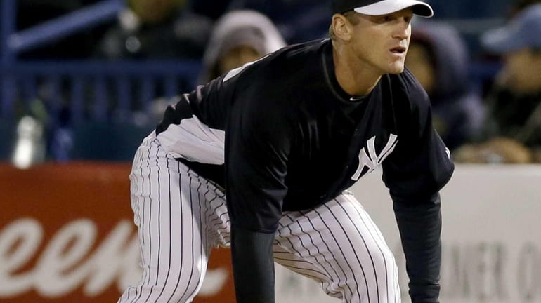 Yankees' Lyle Overbay plays first base in a spring training...