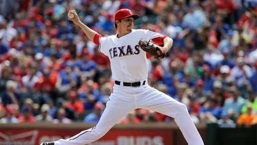Texas Rangers' Tanner Scheppers delivers to the Los Angeles Angels...