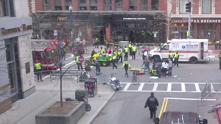 Emergency crews respond to the scene near the Boston Marathon...