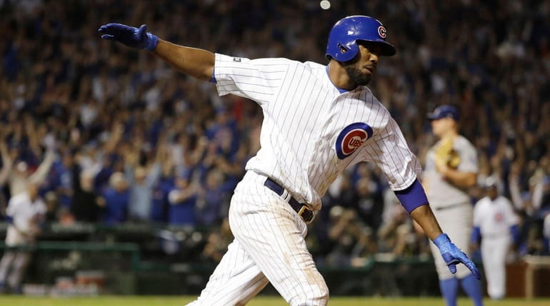 Chicago Cubs' Dexter Fowler runs the bases after hitting a...