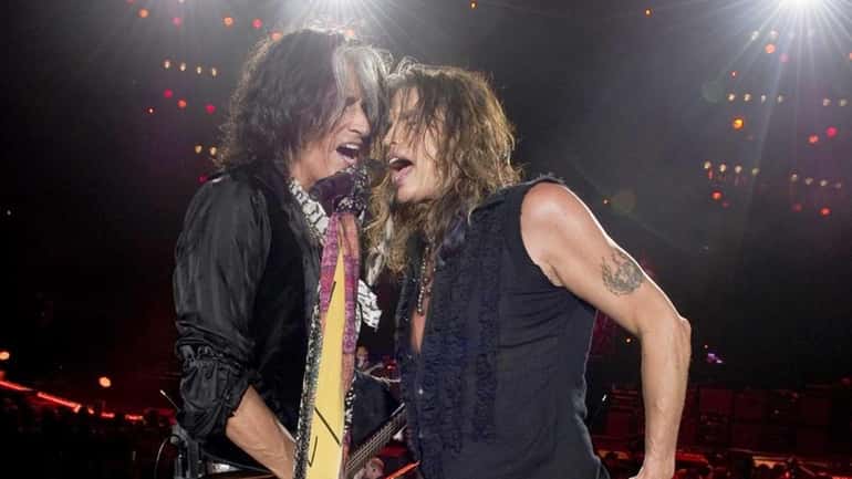 Steven Tyler (right) and Joe Perry perform with Aerosmith in...
