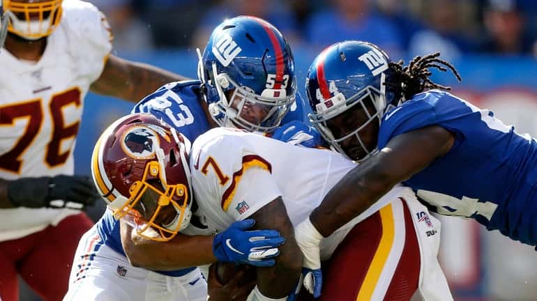 Markus Golden and Oshane Ximines of the Giants takes down...
