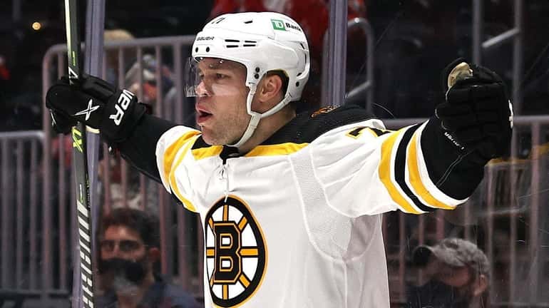 Taylor Hall of the Boston Bruins celebrates his goal to tie...