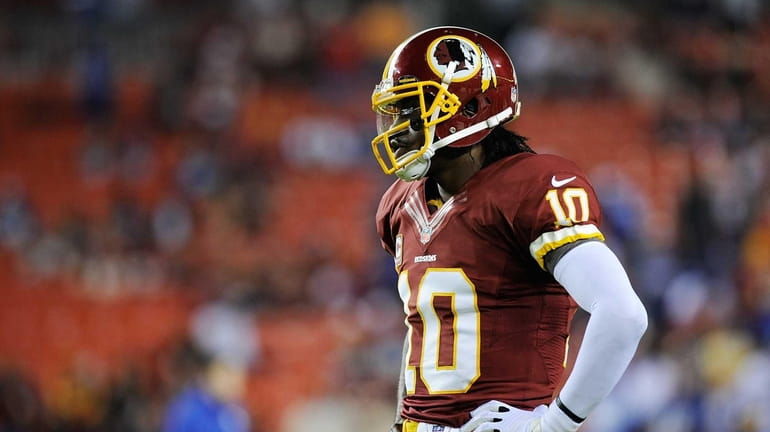 Robert Griffin III of the Washington Redskins reacts before the...