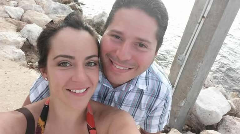 Ernesto Pereira and his wife, Amanda Pereira, put the relief...