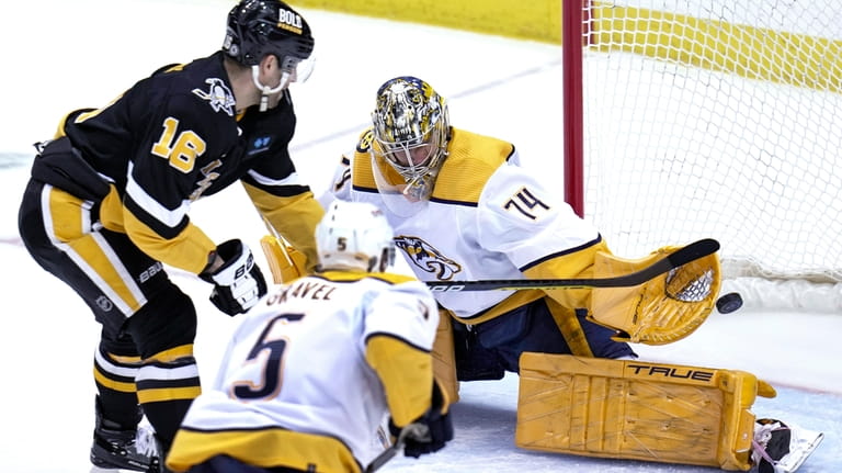 Pittsburgh Penguins' Jason Zucker (16) has a shot blocked by...