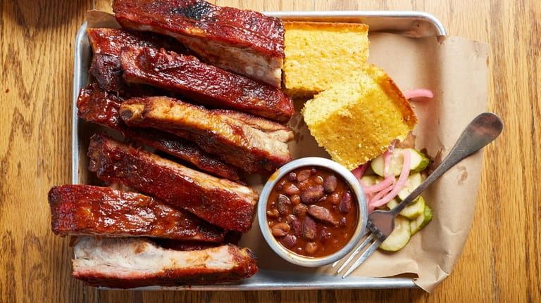 St. Louis style ribs, cornbread, and baked beans at Swingbellys in...