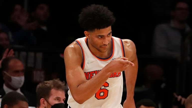 Quentin Grimes of the Knicks reacts after hitting a three-point basket...