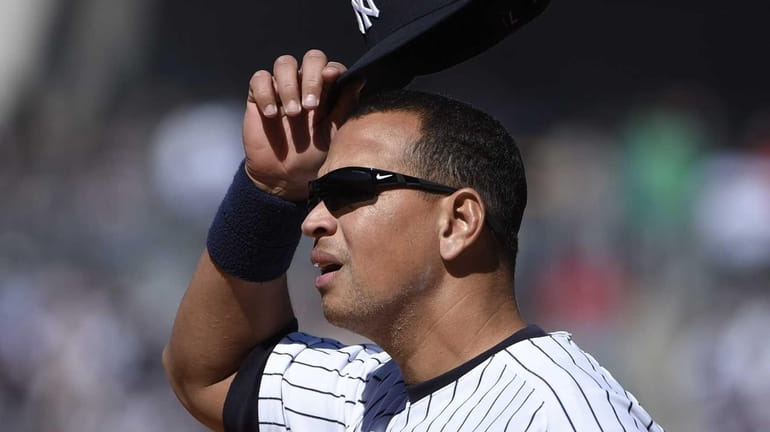New York Yankees first baseman Alex Rodriguez looks on against...
