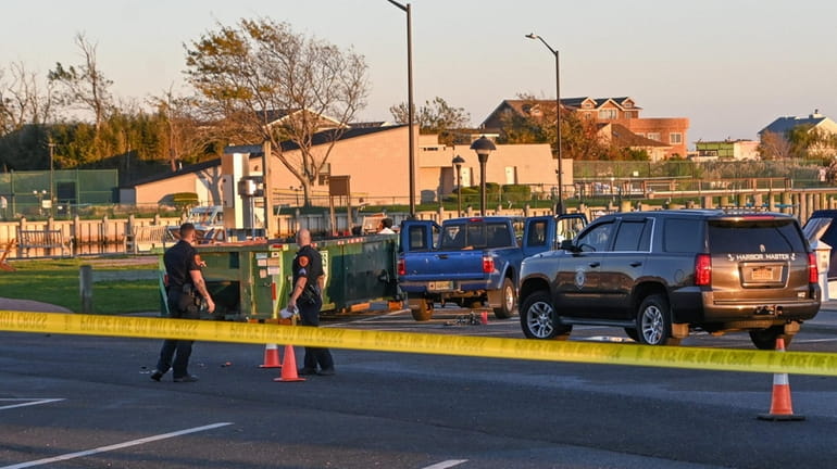 Suffolk police at the scene in Copiague on Saturday where...