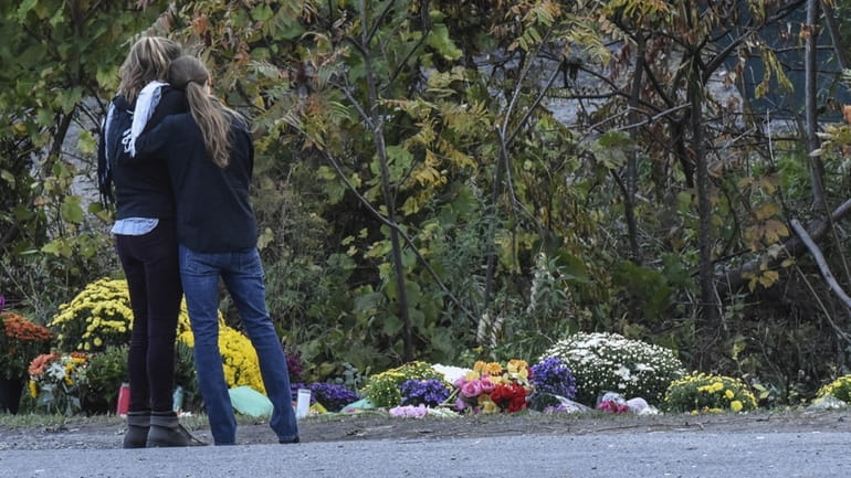 People mourn at the site of the fatal limousine crash...