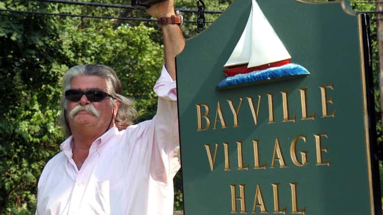 Harry E. Pinkerton III, the newest Bayville trustee stands outside...