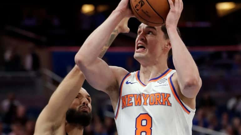 The Knicks' Mario Hezonja goes up for a shot against the ...