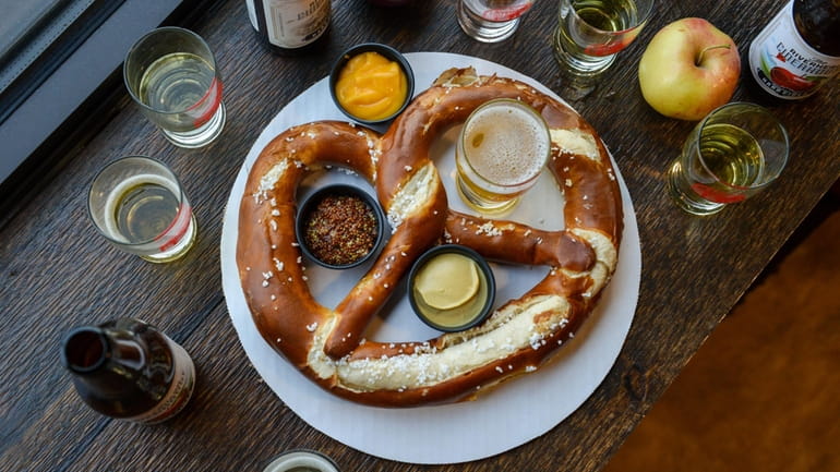 A giant pretzel with dipping sauces at the Riverhead Ciderhouse...