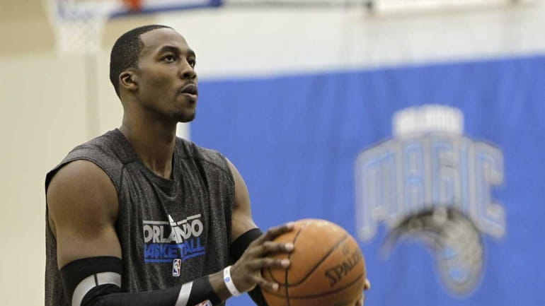Orlando Magic center Dwight Howard shoots free throws after practice...