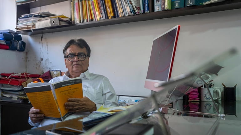 Lawyer Mihir Desai poses for a photograph at his office...