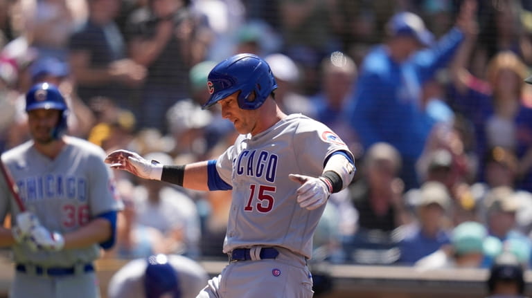 Chicago Cubs' Yan Gomes celebrates after hitting a home run...