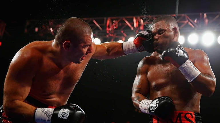 Magomed Abdusalamov punches Mike Perez during their Heavyweight fight at...