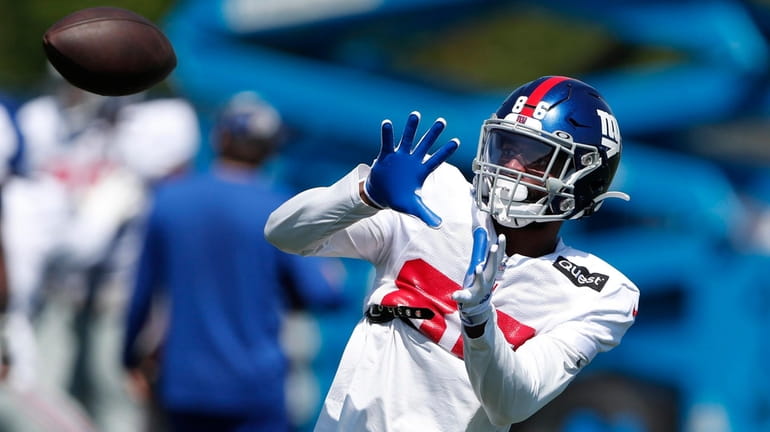 Giants wide receiver Darius Slayton makes a catch during practice on...