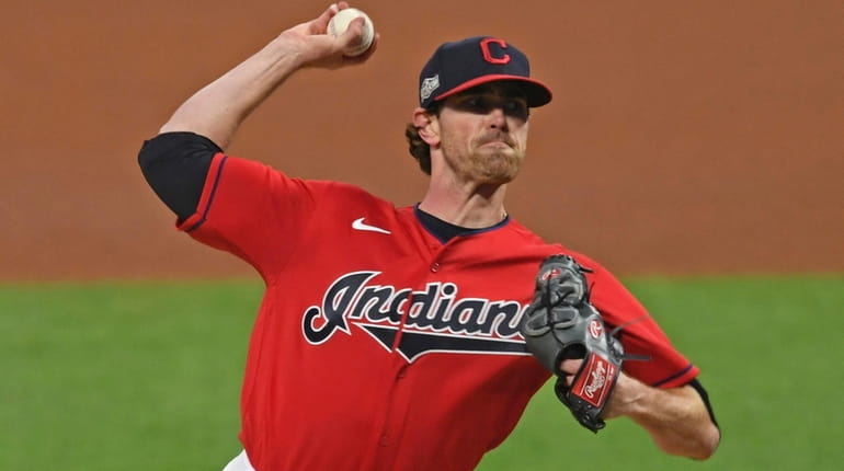 Cleveland starting pitcher Shane Bieber delivers in the first inning...