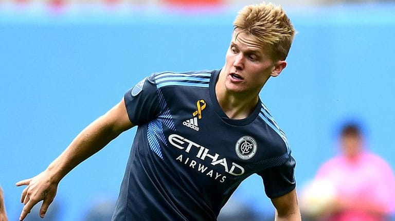 Keaton Parks of New York City FC controls the ball...