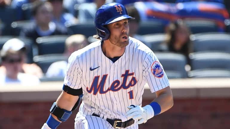 The Mets' Jeff McNeil runs on his RBI double against...