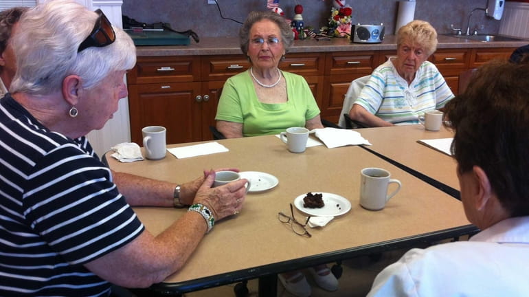 A group of senior citizens participates in the weekly "Coffee...