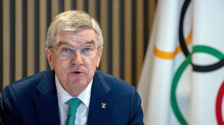 FILE - International Olympic Committee, IOC, President Thomas Bach attends...