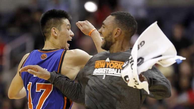 Knicks guard Jeremy Lin celebrates with teammate Jared Jeffries during...