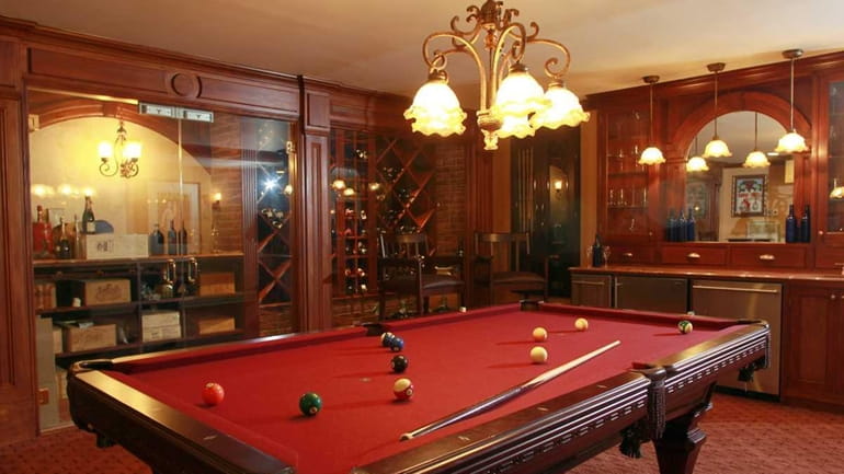 The combination wine room-pool room at a home in Manhasset....