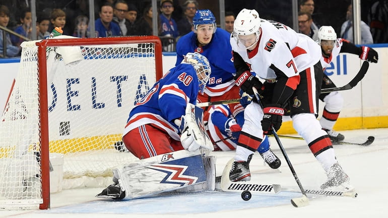 Brady Tkachuk of the Senators scores a second-period goal against Rangers...