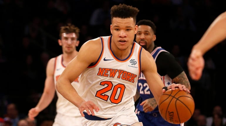 Knicks guard Kevin Knox controls the ball in the first half...