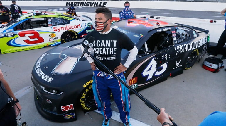 Bubba Wallace is interviewed before a NASCAR Cup Series race...