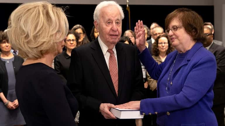Barbara Underwood, right, is sworn in as acting New York...