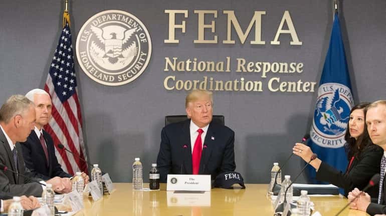 President Donald Trump is briefed on hurricane season during a...