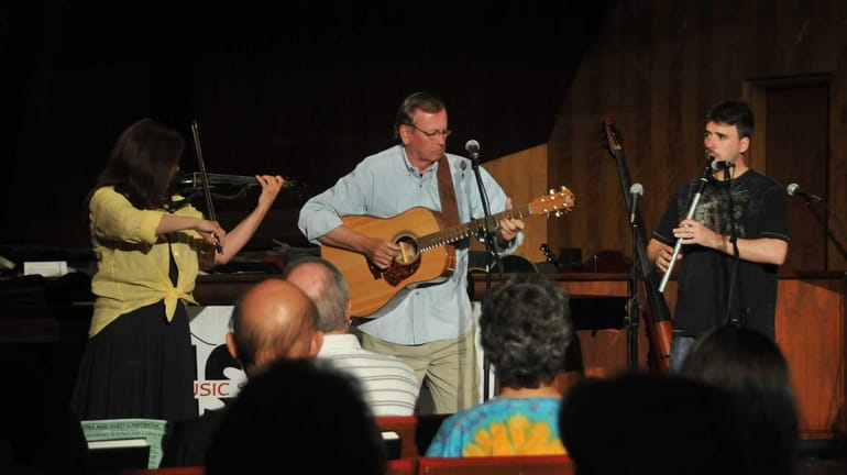 From left: Lynne Bauden on the electric fiddle, Rick Cashman...