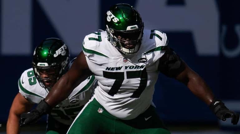 Jets tackle Mekhi Becton  morning steps out to block Colts...